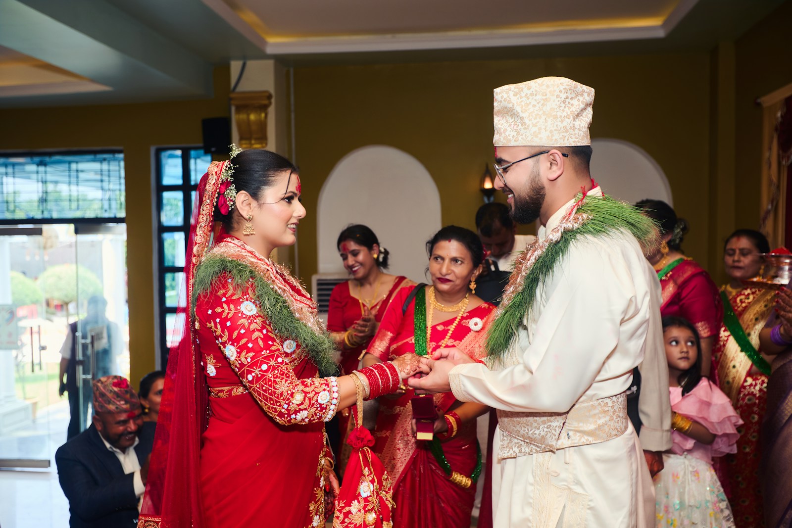 A man and a woman standing next to each other in front of a crowd